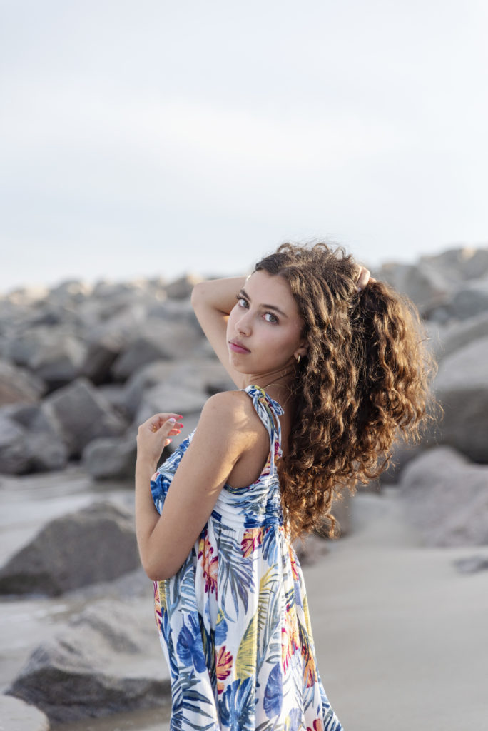 photo of jaden at the beach with her hand in her hair