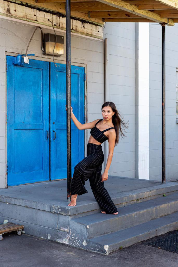 dance photo of jaden leaning from a pole